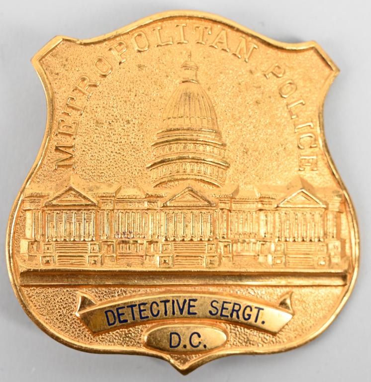 WASHINGTON DC METROPOLITAN POLICE DETECTIVE BADGE: Early Washington D.C. Metropolitan Police badge for the rank of Detective Sergeant. The badge has a vertical pin with a drop catch. It does not resemble a modern or current law enforcement badge, insi