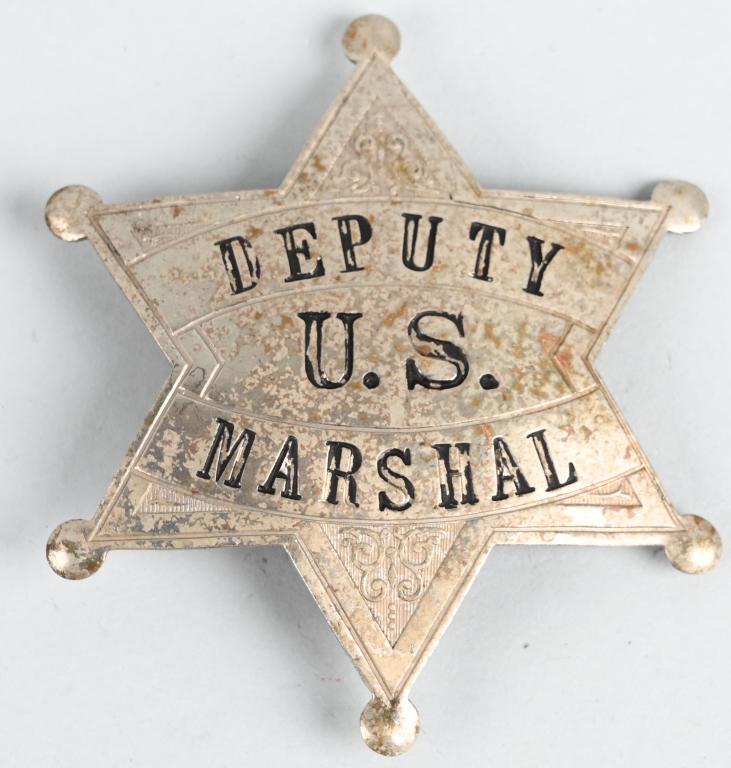 EARLY US DEPUTY MARSHAL BADGE BY LAS&SCO: Early U.S. Deputy Marshal badge measuring 2 X 2 inches with a vertical pin and catch assembly. Maker marked LAS&SCO indicating the manufacturer LOS ANGELES STAMP & STATIONERY Co. Excellent It does not