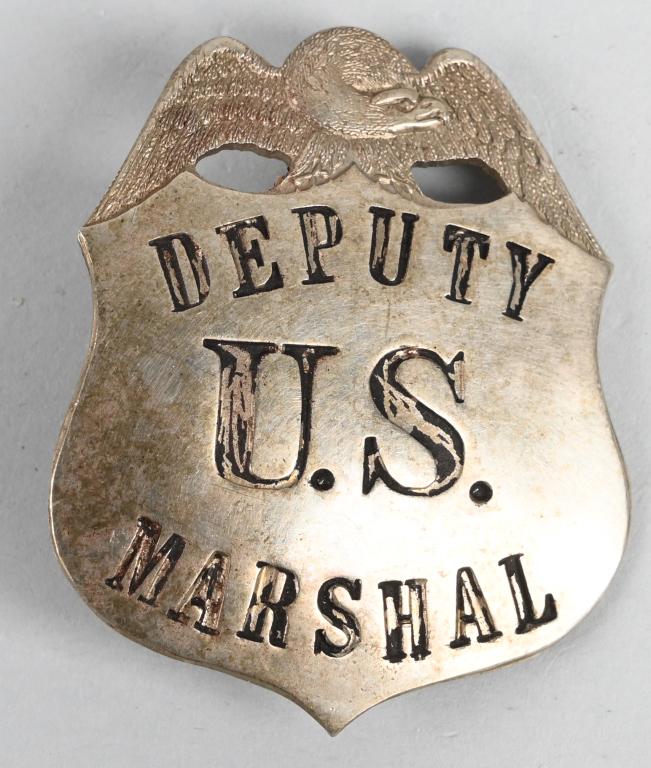 EARLY US DEPUTY MARSHAL BADGE BY LAS&SCO: Early U.S. Deputy Marshal badge measuring 2 X 2 inches with a vertical pin and catch assembly. Maker marked LAS&SCO indicating the manufacturer LOS ANGELES STAMP & STATIONERY Co. Excellent It does not