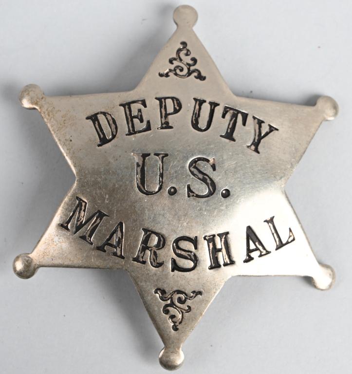 EARLY US DEPUTY MARSHAL BADGE BY LAS&SCO: Early U.S. Deputy Marshal badge measuring 2 X 1/2 inches with a vertical pin and catch assembly. Maker marked LAS&SCO indicating the manufacturer LOS ANGELES STAMP & STATIONERY Co. Excellent It does n