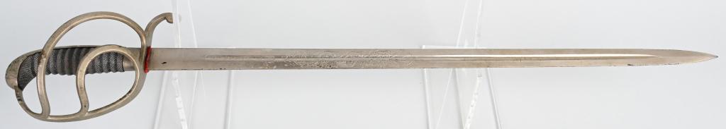 BAVARIAN OFFICER'S SWORD FERDINAND KAHN: Sword with guard, rayskin grips, "IN TREUE FEST" on both sides of the blade, and signed Ferdinand Kahn Germershein. 22.5" blade, 28" overall length. Several small spots on the blade and guard are miss