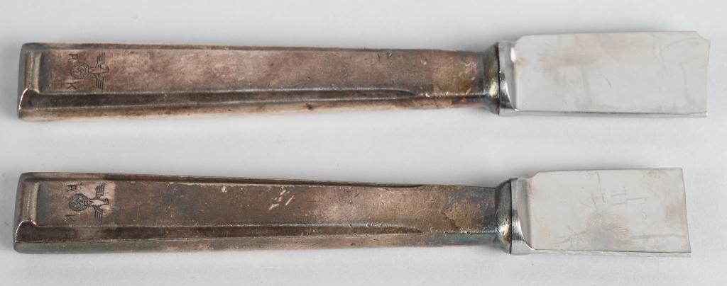 ADOLF HITLER SILVERWARE PERSONAL SERVICE KNIVES: Adolf Hitler – Silverware from his Personal Table Service. Two dinner knives, blades shortened, engraved national eagle with “RK” on handle. Stamped “90” near hilt. Blade etched “Nicht Ros
