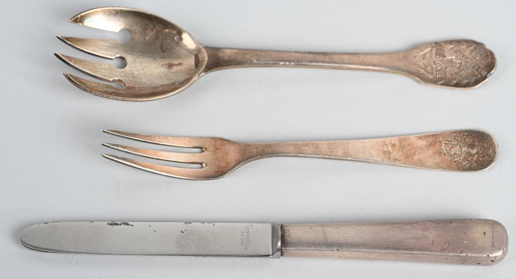 HERMANN GÖRING SILVERWARE PERSONAL TABLE SERVICE: Hermann Goring Silverware from his Personal Table Service. Three pieces of Hermann Goring silver service. Salad fork, obverse engraved with Reichsmarschall eagle between laurel leaves, reverse with an