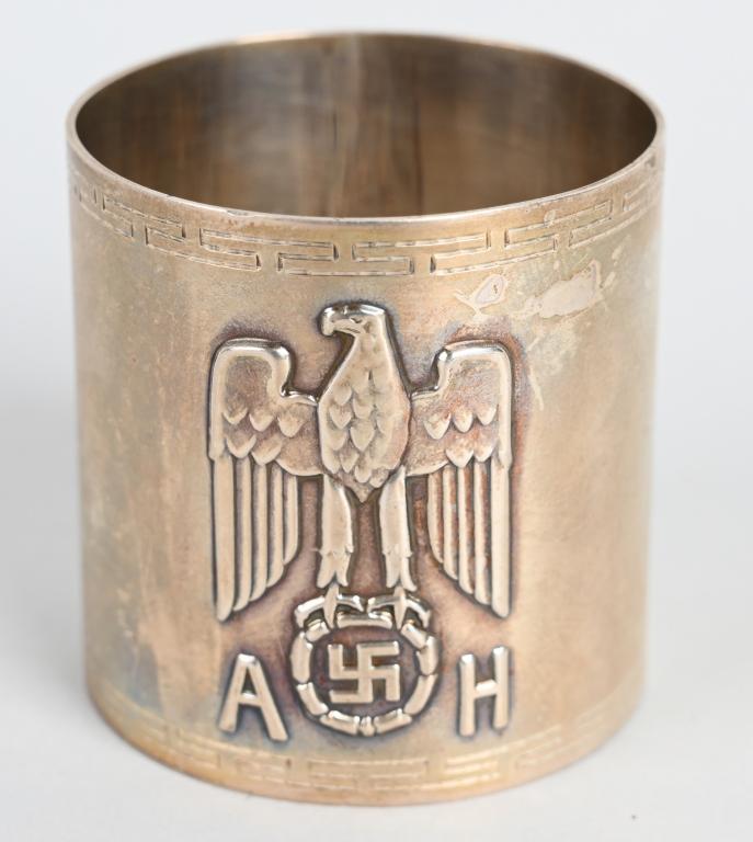 WWII NAZI ADOLF HITLER FORMAL SERVICE NAPKIN RING: ADOLF HITLER FORMAL SERVICE NAPKIN RING Fine original formal silver napkin ring from one of Hitler's formal dinner services, 1 3/4" tall, 1 1/2" diameter, bearing a large Nazi eagle and swastika devic