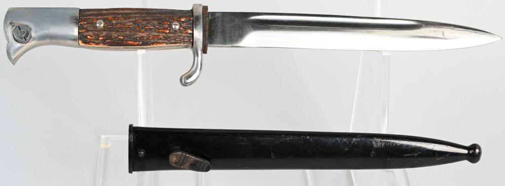 WWII NAZI GERMAN STAG HANDLED DRESS BAYONET PUMA: The hilt of this example looks to have all of the original plating intact. The mortise button and lock work well. The stag plates are in excellent condition. The nuts are intact on the reverse. The sc