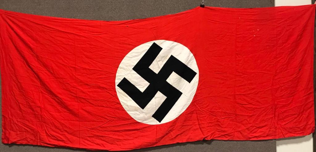 WWII NAZI GERMAN NSDAP LARGE WALL BANNER WW2: Multi-piece cotton construction banner approximately 92 x 108 inches. To both its red fields are white disks, with a printed mobile swastikas in black. Shows the expected period use and wear. Probably