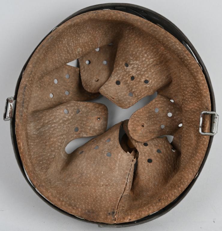 WWII NAZI GERMAN M31 HELMET LINER SIZE 55 WW2: M31 helmet liner. Nice complete leather showing the expected wear and use. The steel liner band is size marked "62". Band is also Rbnr# marked and dated for 1944. Nice liner. The first "modern" steel 