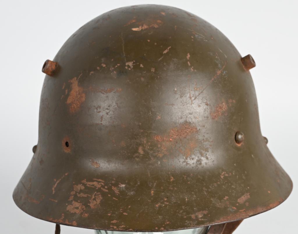 PRE WWII SPANISH CIVIL WAR CZECH M30 HELMET: Czech M30 helmet converted for use in the Spanish Civil War. Has original leather liner and chinstrap. In good condition for its age. Leather is still fairly pliable. Very Good