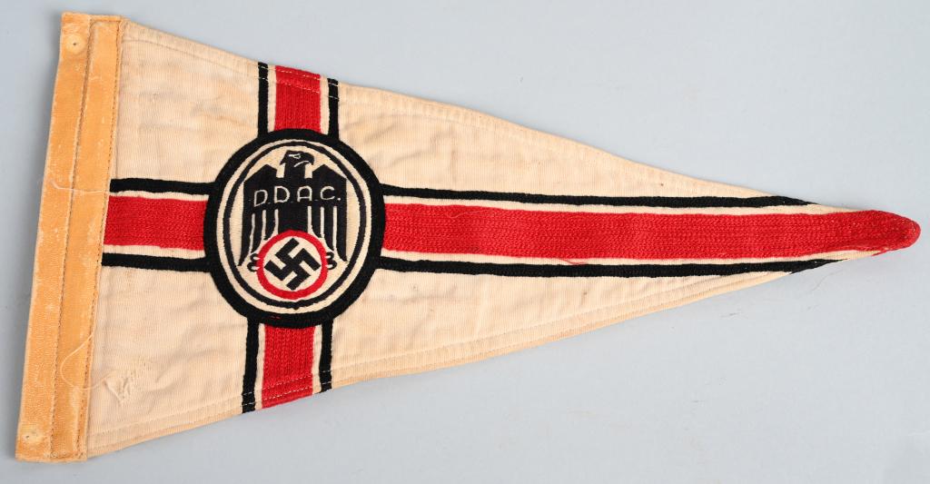 WWII NAZI GERMAN DDAC MEMBER'S VEHICLE PENNANT WW2: A linen construction pennant, 33cm across with a 18cm tall hoist edge. Embroidered to both sides of its white field is a black eagle, with "D.D.A.C." to its breast, and a mobile swastika within a red 