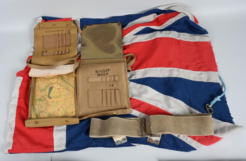 WWII BRITISH MAP CASE, BELT, and BRITISH FLAG: Includes a 1944 dated map case with the British broad arrow, and has a 1943 dated map of northern France. Comes with khaki belt, and British flag which appears to be post-war and is unmarked. Measures