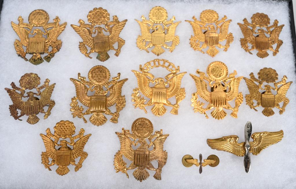 WWII US ARMY / AIR CORP OFFICER CAP DEVICE LOT 13: WWII US Army Officer's cap device lot including 11 cap devices with 9 having there screw back devices. One Army Air Corps Cadet cap badge with screw back device, one wing and prop device for the colla