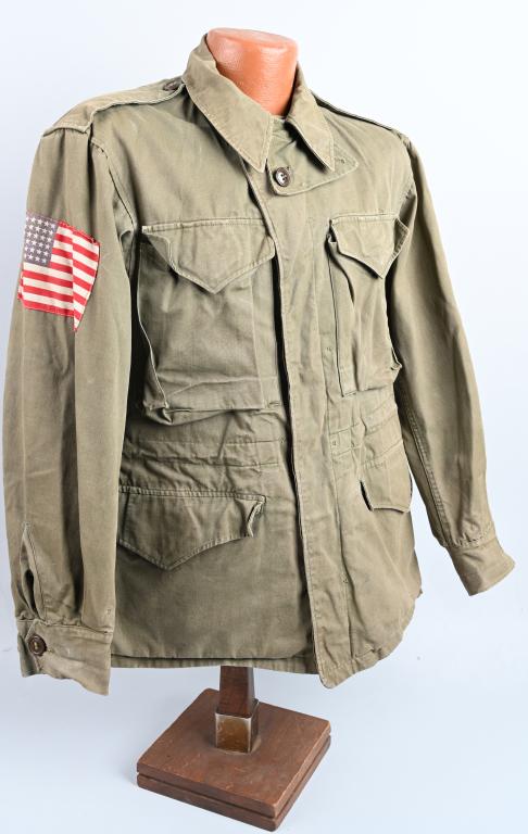 WWII US M1943 82nd AIRBORNE PATCHED JACKET w/ FLAG: WWII US Army 82nd Division patched M1943 field jacket being size marked 34-S and in very good condition having an invasion flag of the wearers right arm. On the left arm is a All American Airborne pat