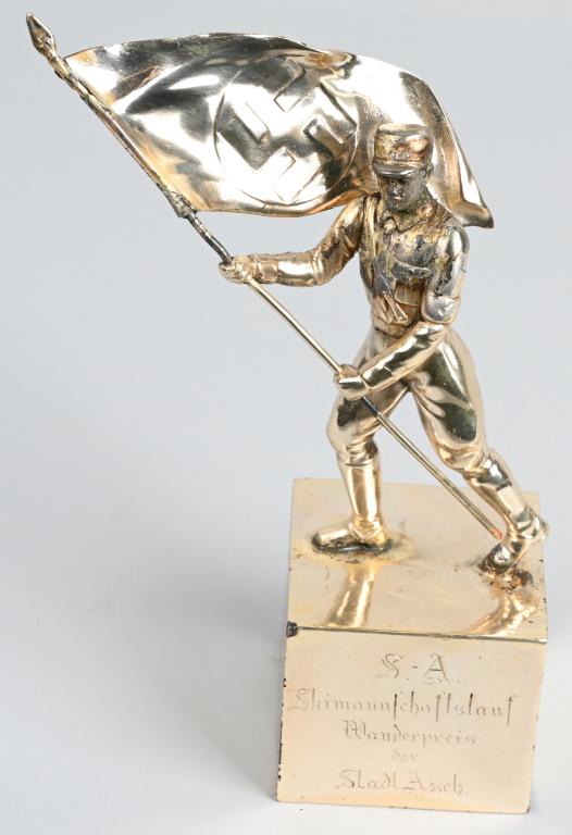 WWII NAZI GERMAN SA TROPHY SKI HIKING AWARD WW2: Large attractive SA service award standing 9 inches tall with the inscription "SA Skimannschaftslauf Wanderpreis der Stadt Asch." (Ski team run hiking prize of the city of Asch.). The SA Mann is holdi