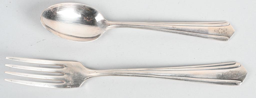 ADOLF HITLER SILVERWARE PERSONAL TABLE SERVICE: Adolf Hitler – Silverware from his Personal Table Service. Group of two pieces silverware, salad fork and tea spoon with engraved initials “AH”. Stamped manufacturer marks WELLNER PATENT 90 15. 