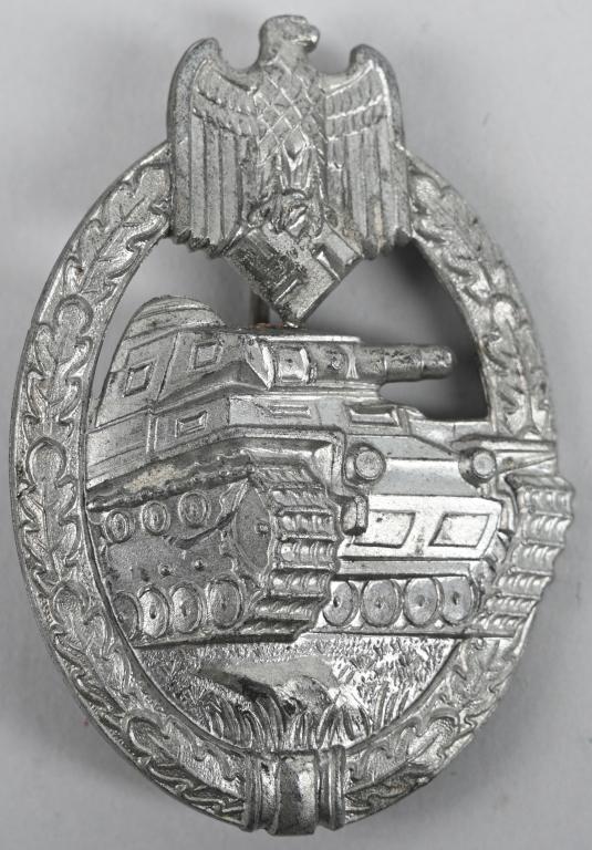 WWII NAZI GERMAN PANZER ASSAULT BADGE SILVER WW2: Die struck alloy construction, solid backed, badge with a silver washed finish features a vertically oval oak-leaf wreath with a Wehrmacht style eagle with down-swept wings, superimposed to the top ce