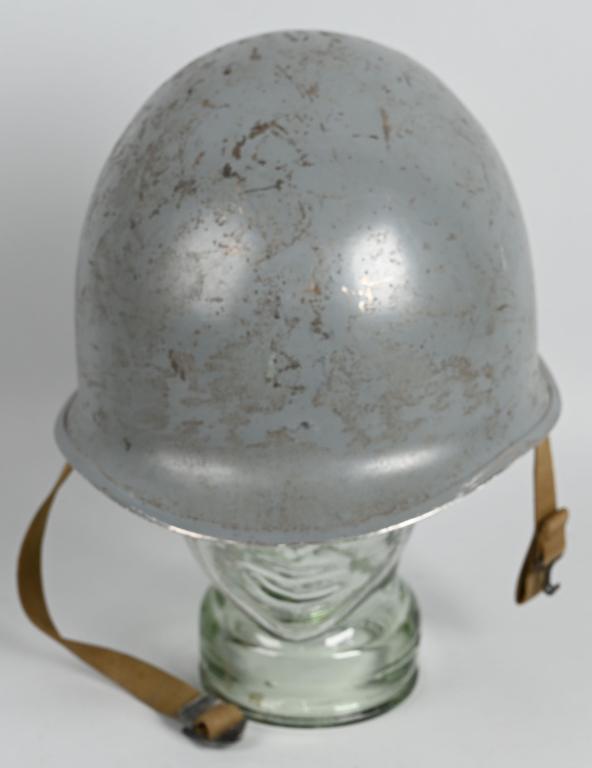 WWII US NAVY M-1 COMBAT HELMET W/ FIRSTONE LINER: WWII US Navy fixed bail M-1 Combat Helmet with Firestone Liner. Helmet has a battleship gray over paint that is 95%. The liner also has been painted gray as well. All the straps are in excellent condi