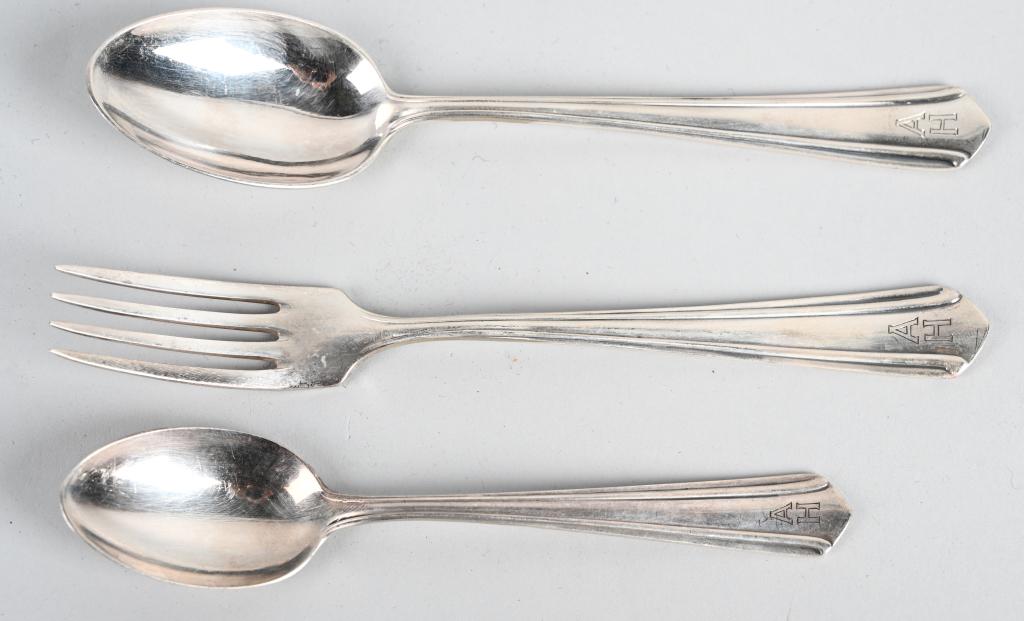 ADOLF HITLER SILVERWARE PERSONAL TABLE SERVICE WW2: Adolf Hitler – Silverware from his Personal Table Service. Group of three pieces silverware, Tea Spoon, Dessert Fork and Dessert Spoon with engraved initials “AH”. Stamped manufacturer marks WEL