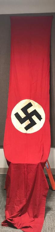 WWII NAZI GERMAN NATIONAL PARTY FLAG WW2: Large multi-piece cotton construction banner approximately 94 x 38 inches. To both its red fields are sewn an white disks with a printed mobile swastikas in black. Shows the expected period with stain