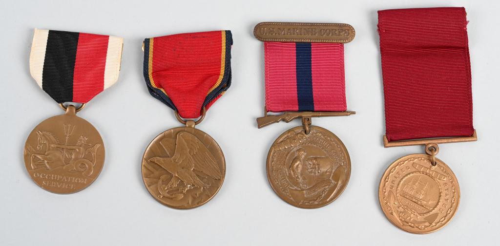 WWII US NAVY AND MARINE CORPS MEDALS NAMED WW2: WWII era Navy and Marine Corps medals including a named Good Conduct medal awarded to Pete Nick Evkovich in 1946 for service which spanned the war, Also includes post-war Occupation medal with navy pl