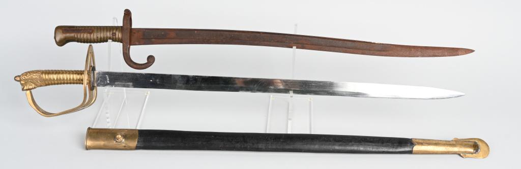 2 EARLY BRASS HANDLED KNIVES CHASSEPOT: 1- French Model 1866 Chassepot Bayonet in rough condition with no scabbard; has 22.5" blade, 27.5" overall length. 2- "India" signed short sword with brass grip and guard, lion-head pommel, leather & 