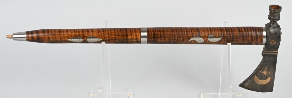 CONTEMPORARY PEACE PIPE W CRESCENT MOON STAR MOTIF: Contemporary peace pipe with fine inlays of German silver. The head has a Crescent moon and North Star motif, 19 inches in total length and the pipe functions properly with tiger stripe maple wood han