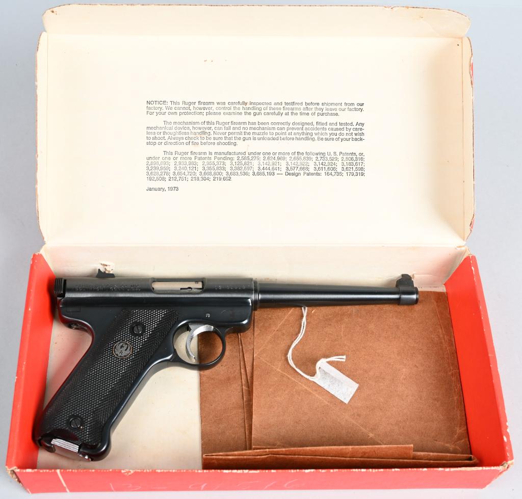 BOXED RUGER 200TH YR SEMI AUTO PISTOL: SERIAL 13-91516. BARREL 6". CALIBER .22 LONG RIFLE. Features blue finish, fixed sights, black checkered plastic grips with black eagle, one magazine in red box. Near new with one minute frecke on righ