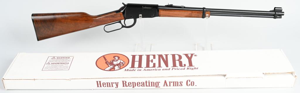 BOXED HENRY H001M LEVER ACTION 22 MAG RIFLE: SERIAL M203036H. BARREL: 18.75" CALIBER" 22 MAGNUM / WMR Lever action, shrouded blade front sight, adjustable rear sight, checkered grip, blued finish, tube feed magazine below barrel. Comes in origin