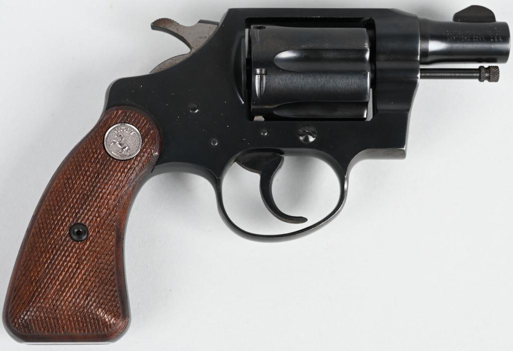 COLT DETECTIVE SPECIAL REVOLVER: SERIAL 824414. BARREL 2". CALIBER .38 SPECIAL. MADE IN 1963. Lovely old school with exposed ejector rod, blue finish, six shot double action with round butt silver medallion checkered walnut stocks. H