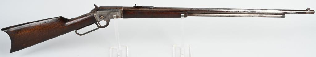LONG BARREL MARLIN MODEL 1892 RIFLE: SERIAL 265279. BARREL 28". CALIBER .32 MADE IN 1903. Features full round barrel, 2/3" magazine, semi-buck horn rear sight, blade front sight, walnut stocks. This model came with two firing pins, one C