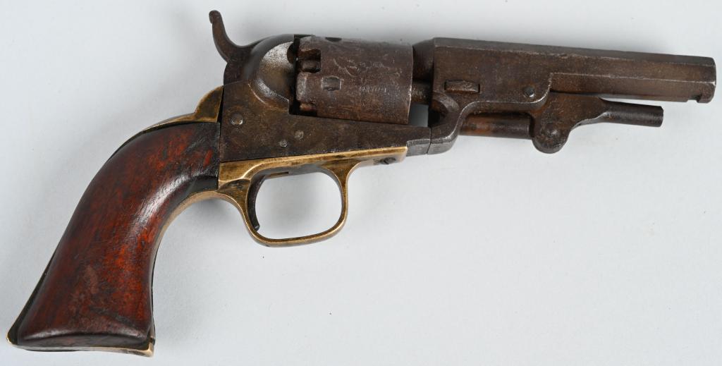 COLT MODEL 1849 PERCUSSION REVOLVER: SERIAL 160580. BARREL4". CALIBER .31. MADE IN 1860. Has New York address. Features a full octagon barrel, five shot, single action brass straps, one piece walnut grips. All matching numbers including 