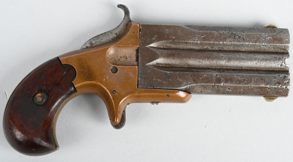 MARSTON OVER UNDER DAGGER DERRINGER: SERIAL NSN. BARRELS 3". CALIBER .32 RIMFIRE. Gun appears to be a Marston but there are no markings of any kind. Features brass frame, walnut birds head grips, spur trigger, gun metal gray barrels with