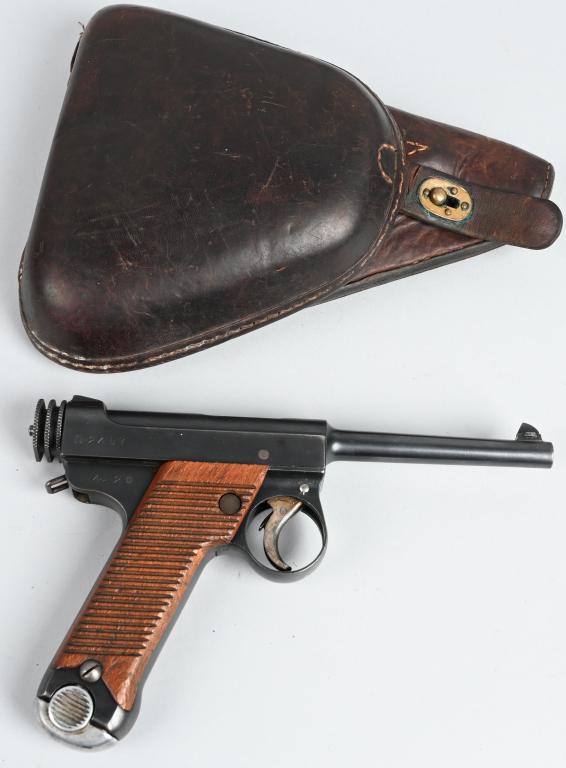 HIGH CONDITION NAMBU TYPE 14 PISTOL (1929): SERIAL 2457. BARREL 4.61". CALIBER 8X22. MADE IN 1929 at the Tokyo Arsenal. Beautiful straw colors on trigger & safety. Serial number 124 stamped inside both grips. 4.2 year code. Has correct correspo
