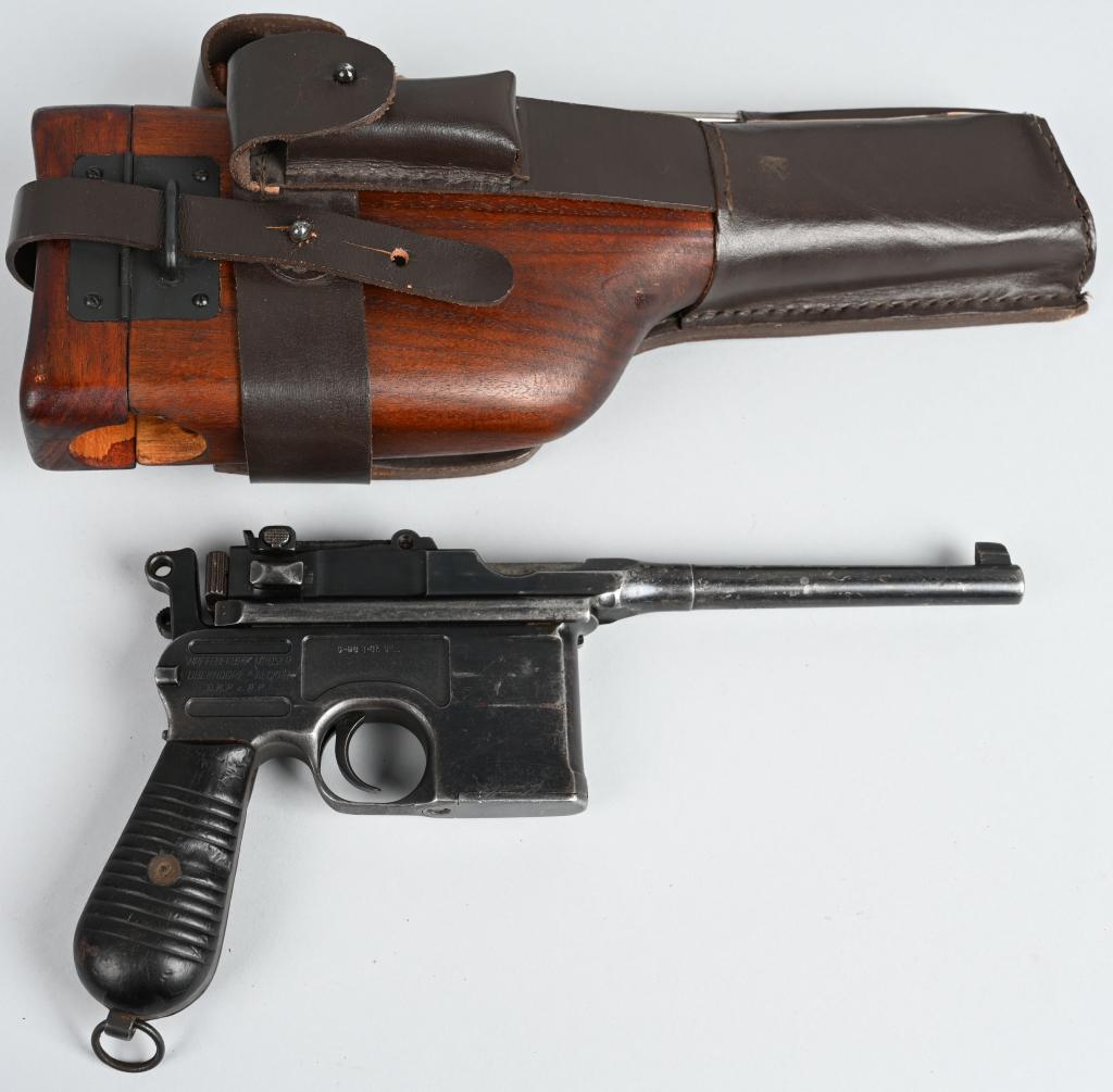 EARLY MODEL 1930 MAUSER C-96 BROOMHANDLE PISTOL: SERIAL 890313. BARREL 5.2". CALIBER 7.63. This commercial 1930 has import stamps. All legends are sharp. Gun retains about 75% blue with some age spotting on barrel, overall high edge wear and handlin