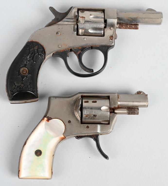 PAIR OF EARLY POCKET REVOLVERS: A. BABY HAMMERLESS. NSN. BARREL 1.25". CALIBER .22 SHORT. Features folding hammer, factory nickel finish, pearl grips, 6-shot, double action. Not working. 85% finish with dark spots of patina. B. 4856