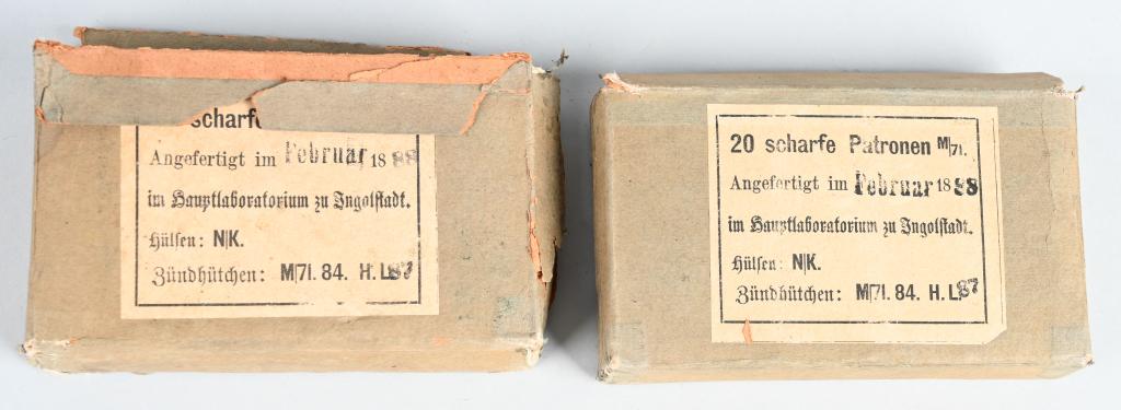 27 ROUNDS 11mm MAUSER M71 RIFLE AMMO DATED 1888: 19th Century Imperial German Mauser rifle ammunition in the original paper labeled boxes. Both bear a production date on the label of February of 1888. One ful 20-round box and one partial 7-round box