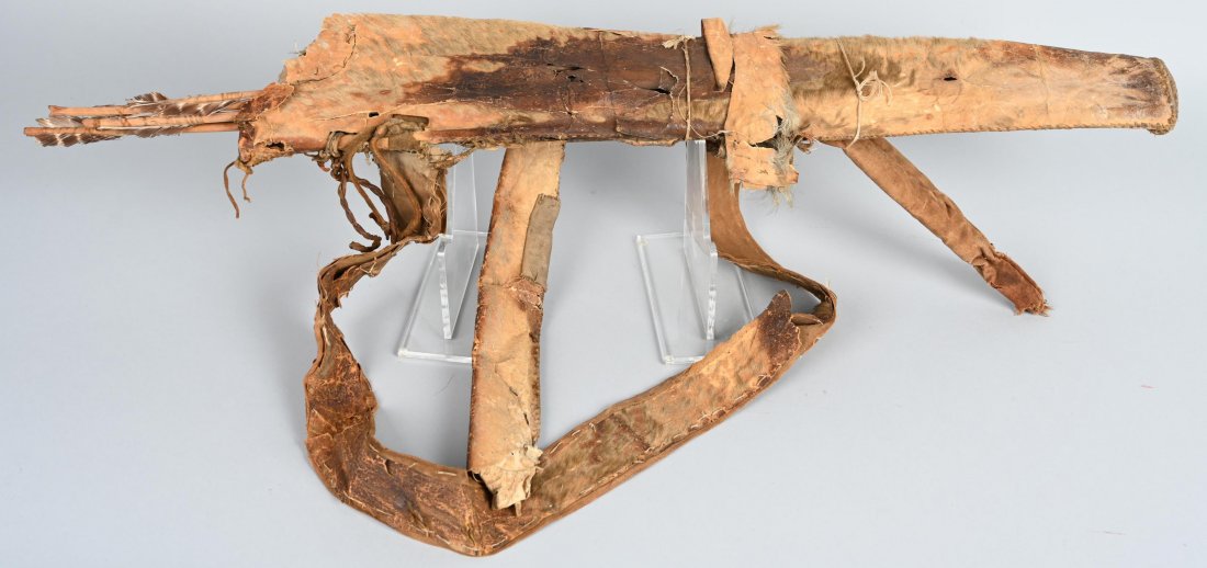 1850s NATIVE AMERICAN QUIVER & ARROWS: Very early hide quiver with much 6 hand-carved wooden arrows. Quiver features blue and black glass beadwork, indicitave of the Sioux tribes, ca. mid 19th century. Remnants of original fur remain. Fair