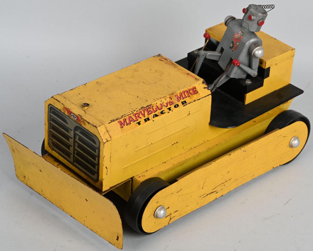 MARVELOUS MIKE ROBOT TRACTOR: Original battery operated Robot Tractor. Missing rubber treads. Battery box has minor corrosion. Was not tested. 13" Very Good