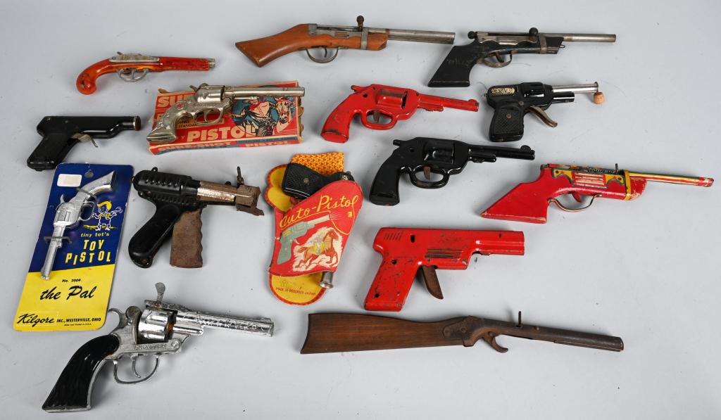 15- VINTAGE TOY GUNS: Lot includes paper guns, cap guns, pop guns and more. Largest is 12". Condition vaires most are Good-Very Good
