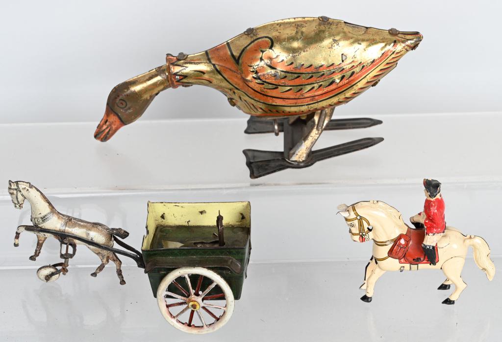 3- VINTAGE Tin Windup TOYS, MARX & GERMAN: Lot includes a tin windup U.S. Zone Germany horse with composition Redcoat soldier, a G&K Horse Cart missing driver, with touchup, along with a Marx Golden Goose tin windup. Both worked when tested. T