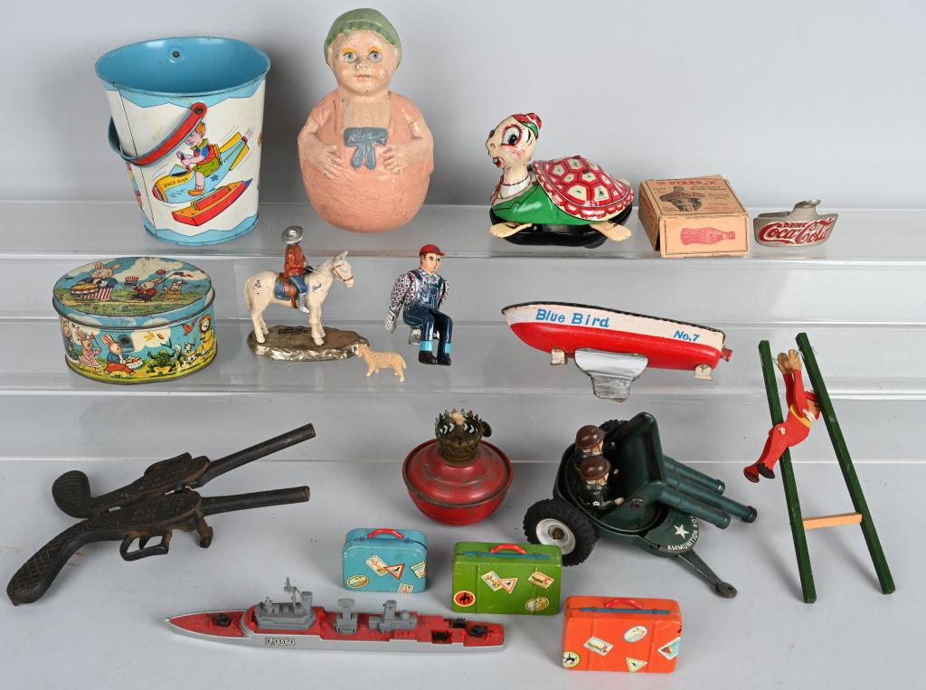 VINTAGE TOY LOT and MORE: Lot includes early 7" Rolly Polly, a Chein tin sand pail, a Japan tin Turtle, a cast iron Bull Dog Boot jack, a cast iron Coca Cola bottle opener in box and more. Condition varies. Overall Very Good