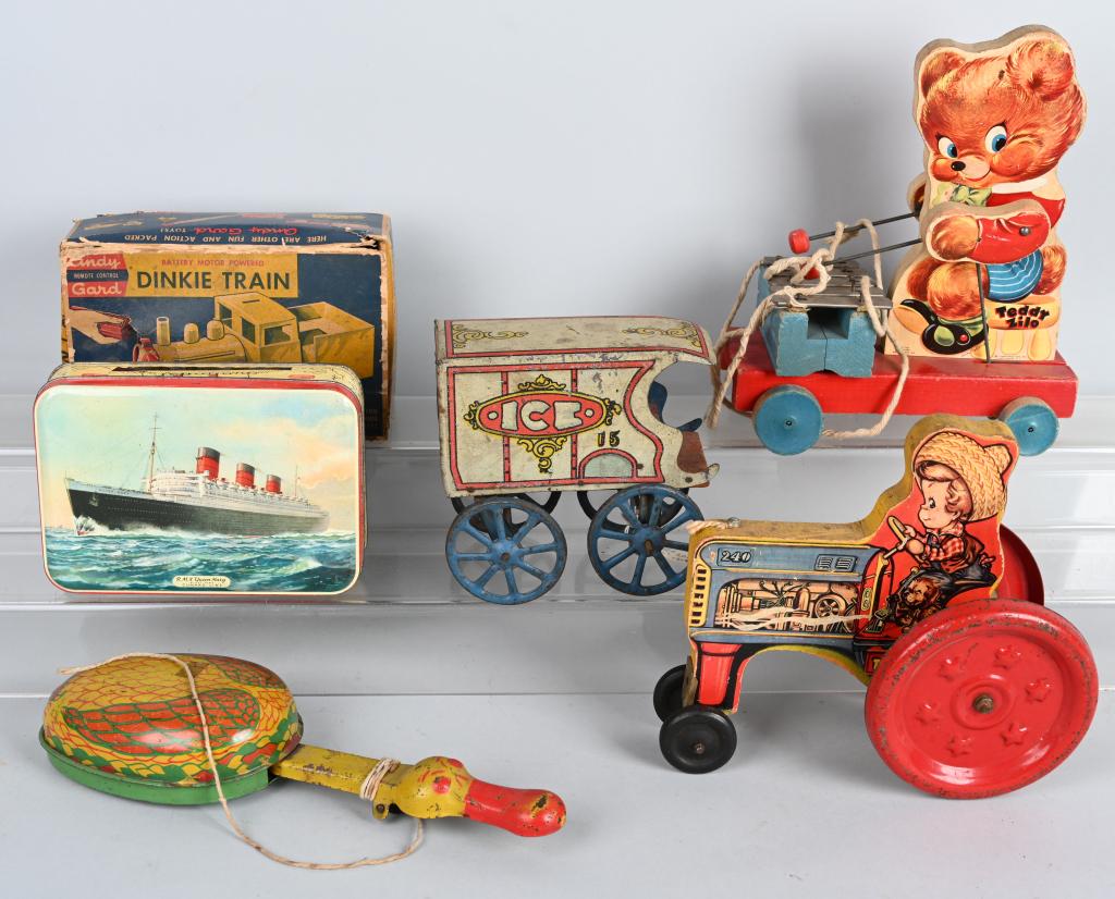 VINTAGE TOY LOT: Lot includes Fisher Price Teddy Zilo, Gong Bell Tractor, Coverse Ice Wagon, Tin Duck pull toy, Andy Gard train in box missing remote, and Bensons candy tin. Largest is 11". Condition varies. Good-Very