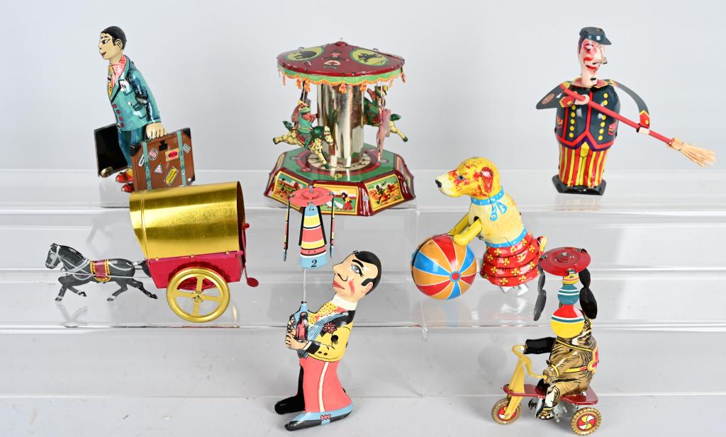 7- PAYA TIN TOYS: Nice grouping of contemporary Paya toys. 6 are windups and worked when tested. Horse drawn cart is a pull toy. The Merry-Go-Round has some dicoloration to tin. Great colors and details. Largest is 8",