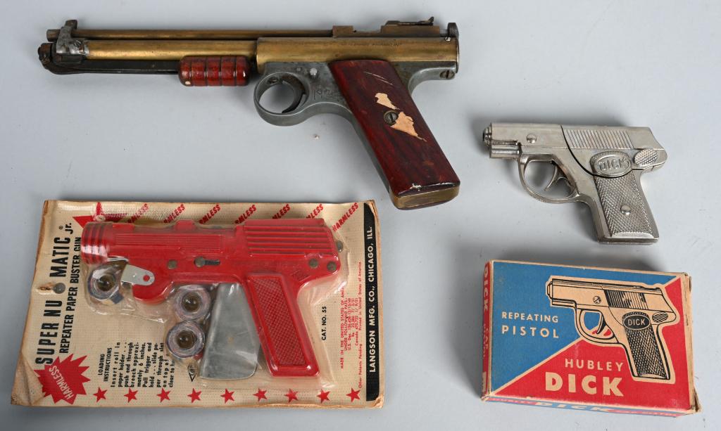 3- VINTAGE TOY PISTOLS: Lot includes a Benjamin Franklin Pellet gun in working condition, a Hubley Dick in original box, along with a Langston PaperGun sealed in the original package. Largest is 10", The Benjamin Franklin ha