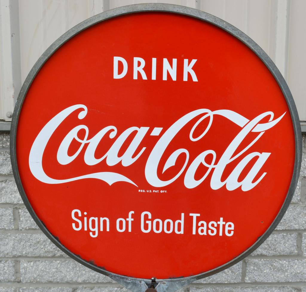 Drink Coca-Cola Sign of Good Taste Porcelain Sign: rated 9, 30"D., DSP sign has excellent gloss and color, is mounted in a ring an on an original Coca-Cola cast iron base