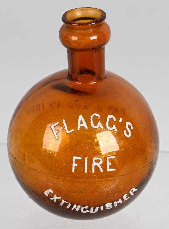 Flagg's Fire Extinguisher Hand Grenade: brown glass, in very good condition, is embossed which has been repainted, is empty, flea bite chips around the rim, 6.5"T.