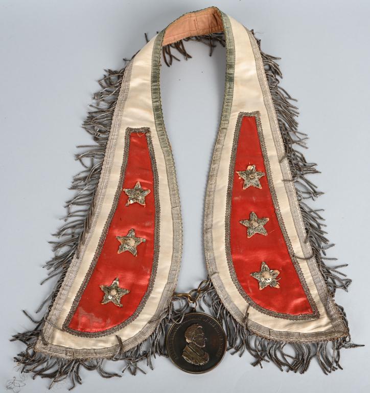 1862 ABRAHAM LINCOLN INDIAN PEACE MEDAL & COLLAR: Beautiful re strike of the 1862 Abraham Lincoln Peace medal and collar. Most likely made in the early 20th century. Medal measures about 2 7/8" diameter. Obverse design is a caped bust with name and t