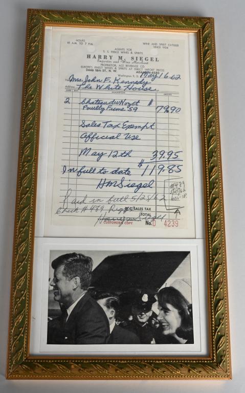 MRS. JOHN F KENNEDY RECEIPT: Original receipt from Harry M Siegel made out to Mrs John F Kennedy address The White House. Looks to be for the purchase of wine. Paid by check. Receipt is signed by Harry Siegel. Framed with picture