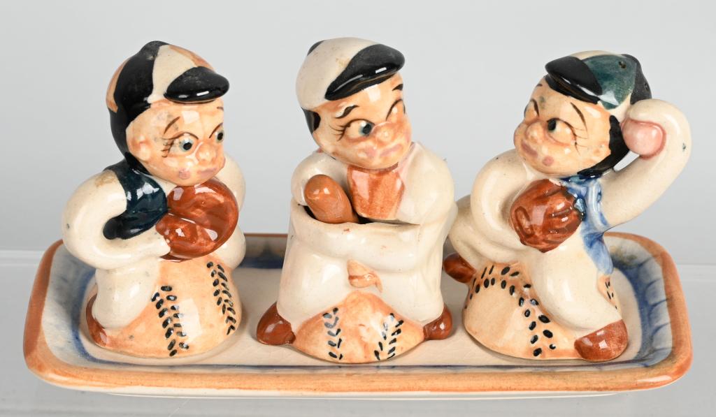 1930'S JAPAN BASEBALL FIGURE TABLE SET: Three figures with original tray. All marked Made in Japan. Salt, pepper & mustard server. Includes a pitcher, catcher and batter which is two piece and bat is spoon. Near mint .