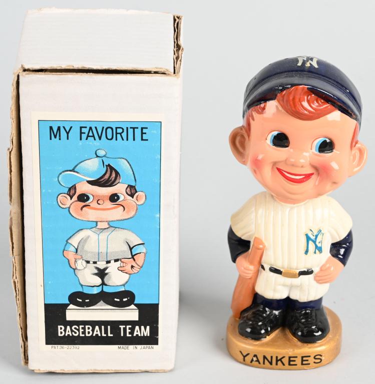 BOXED GOLD BASE N.Y. YANKEES BOBBLE HEAD: This is a near mint with one little painted chip on bill and no head cracks. Light decal chip off hat. Bright color. Comes in original stamped box.