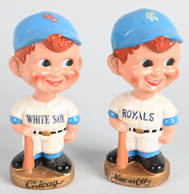 (2) WHITE SOX & ROYALS GOLD BASE BOBBLE HEAD: The White Sox has some chipping at base of head and small chip of paint loss on gold base with great decals only missing part of O. KC has one small head hairline with minor roughness at base of head,